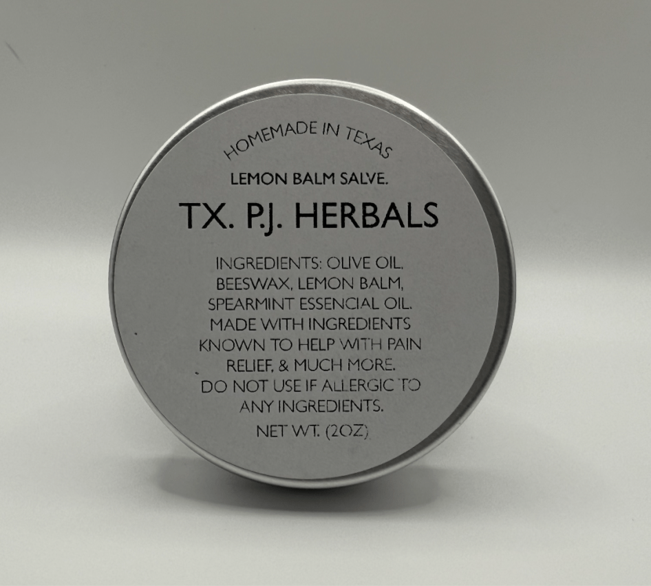 Round tin container of Lemon Balm Herbal Salve by TX. PJ. Herbals with ingredients and usage information on the lid.