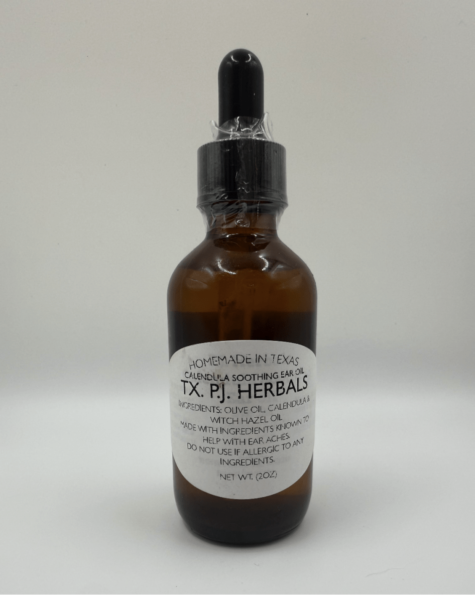 Brown glass dropper bottle of Calendula Earache Relief Oil by TX. P.J. Herbals with label detailing ingredients and usage.