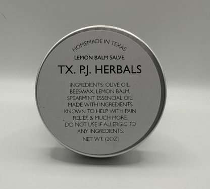Round tin container of Lemon Balm Herbal Salve by TX. PJ. Herbals with ingredients and usage information on the lid.