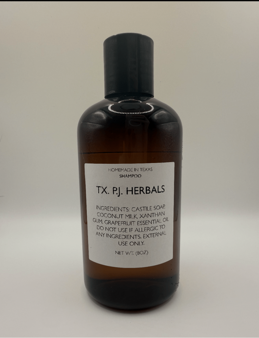 8 oz bottle of all-natural shampoo with pure ingredients, no added chemicals, labeled TX PJ Herbals, nourishing and moisturizing hair.