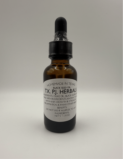 Brown glass dropper bottle of black seed oil for skin, hair, and digestive support by TX P.J. Herbals