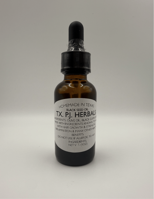 Brown glass dropper bottle of black seed oil for skin, hair, and digestive support by TX P.J. Herbals