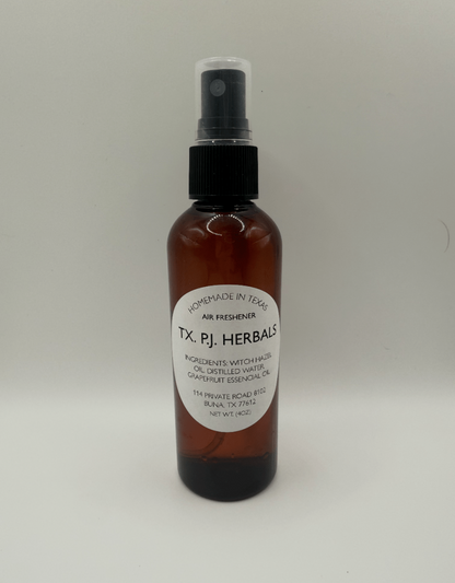 Brown spray bottle of all-natural air freshener with label showing ingredients witch hazel and grapefruit essential oil safe for families and pets