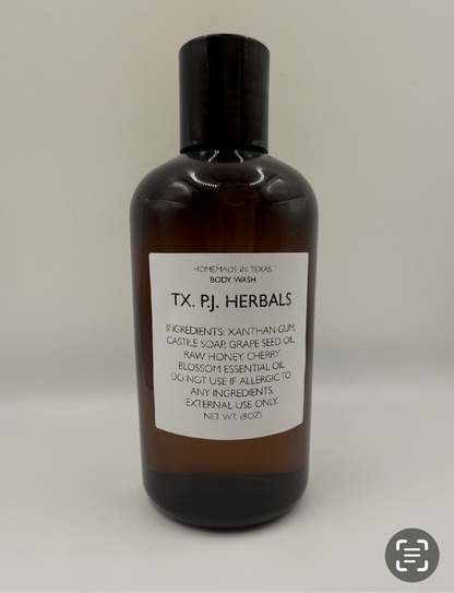 8 oz brown bottle of all-natural body wash with organic ingredients label from TX. PJ. Herbals