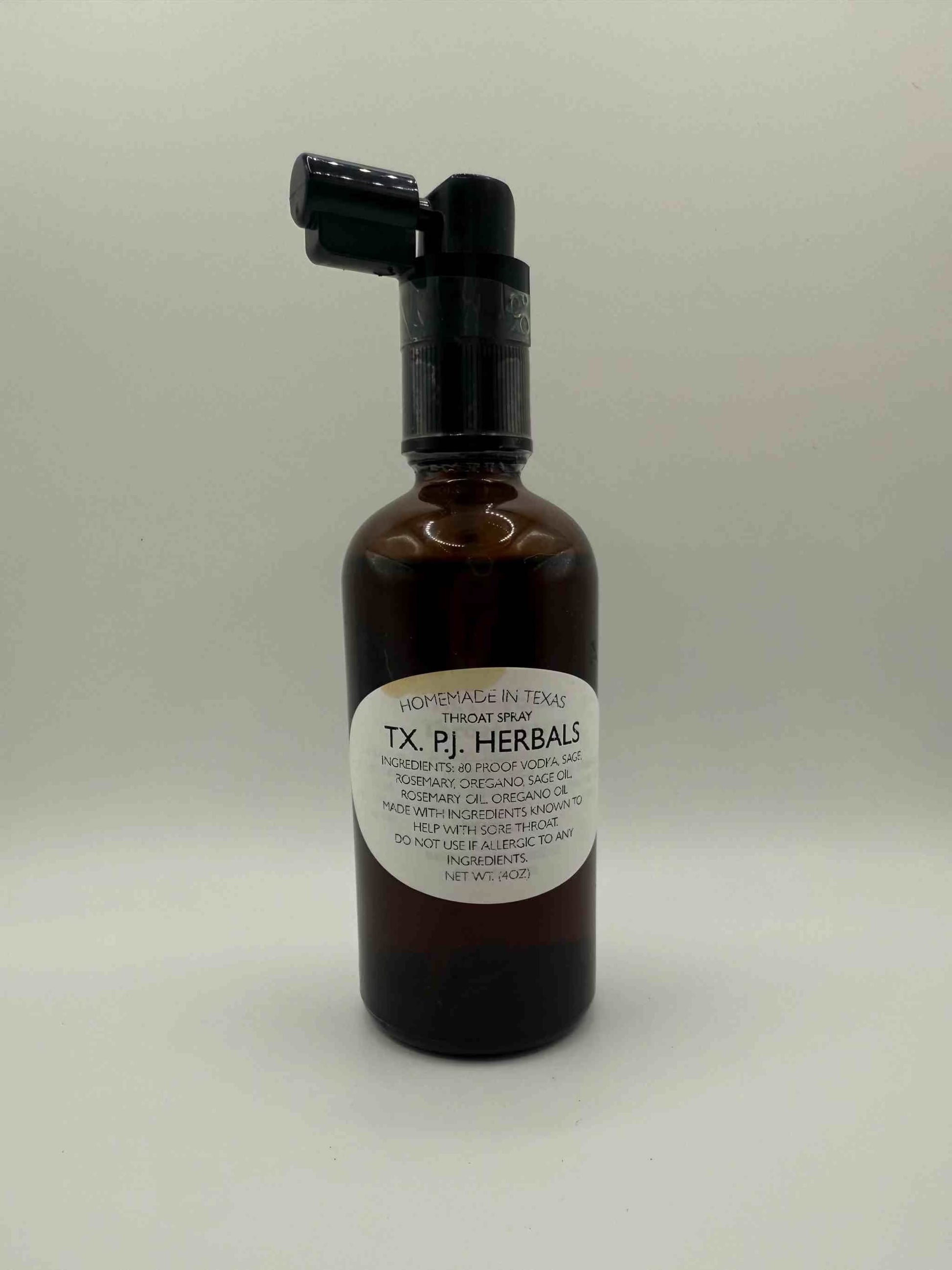 Herbal Throat Spray in brown bottle with black spray top for natural sore throat relief