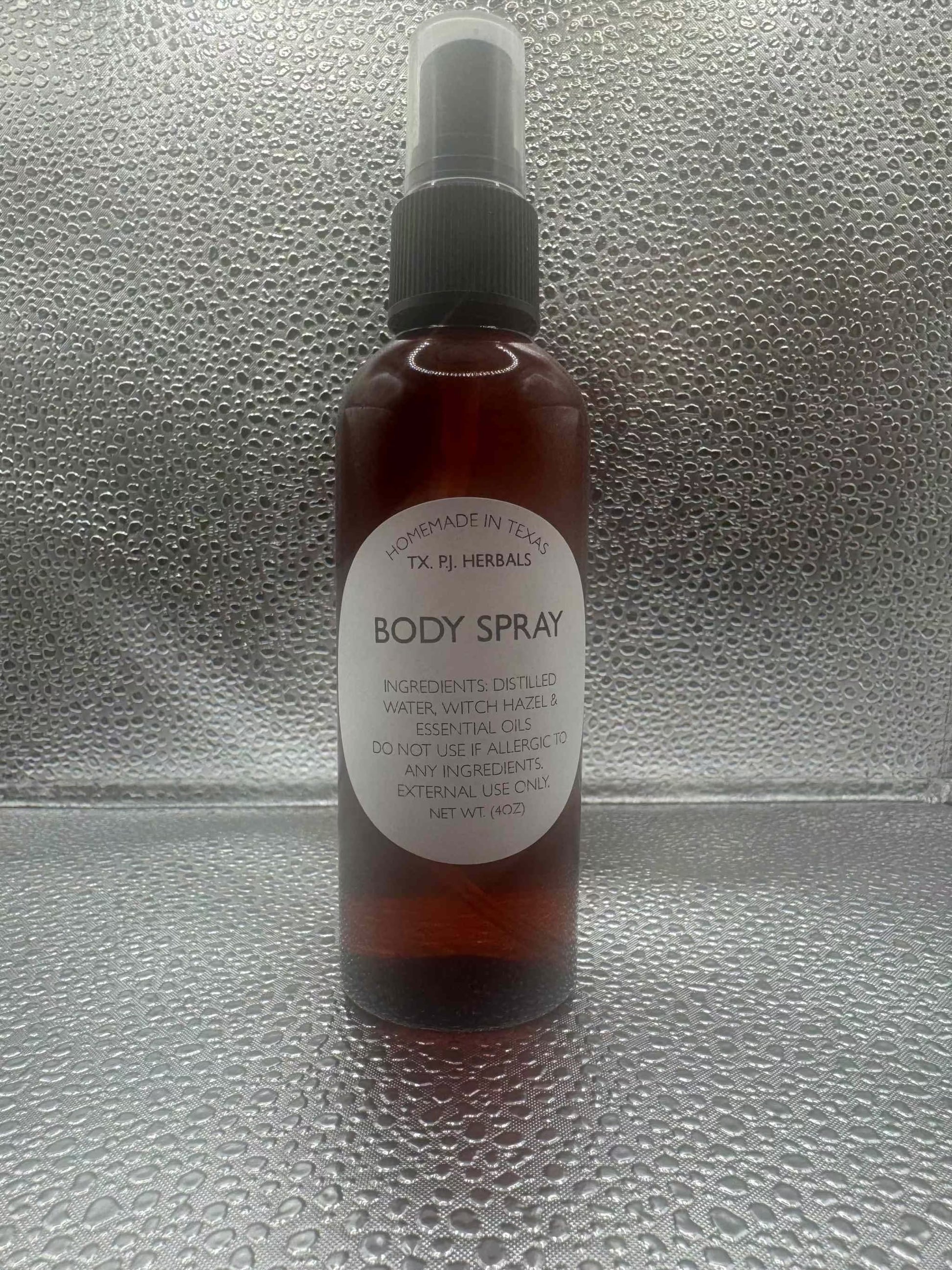 All-natural body spray in amber bottle with spray nozzle, made from distilled water, witch hazel, and essential oils, chemical-free fragrance