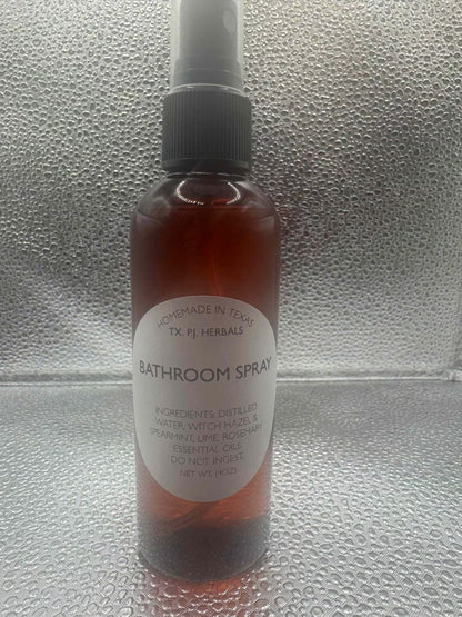 All-Natural Bathroom Spray in amber bottle with herbal ingredients for safe odor elimination and refreshing scent