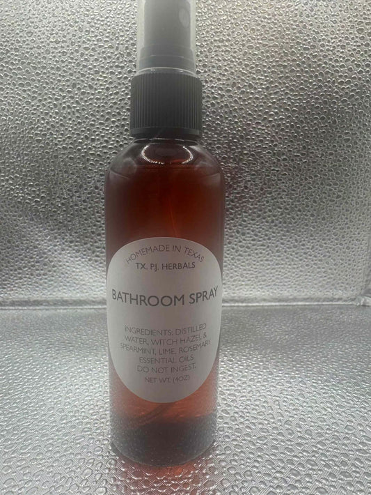 All-Natural Bathroom Spray in amber bottle with herbal ingredients for safe odor elimination and refreshing scent