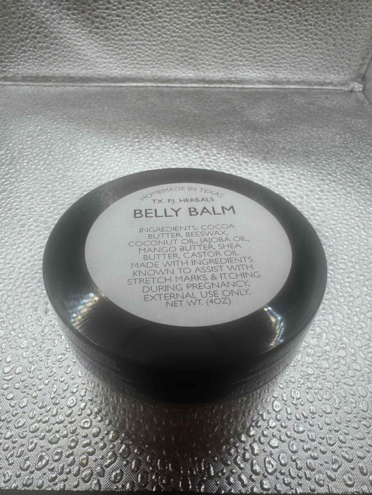 Black jar of All-Natural Belly Balm for reducing stretch marks and soothing itching during pregnancy on textured surface