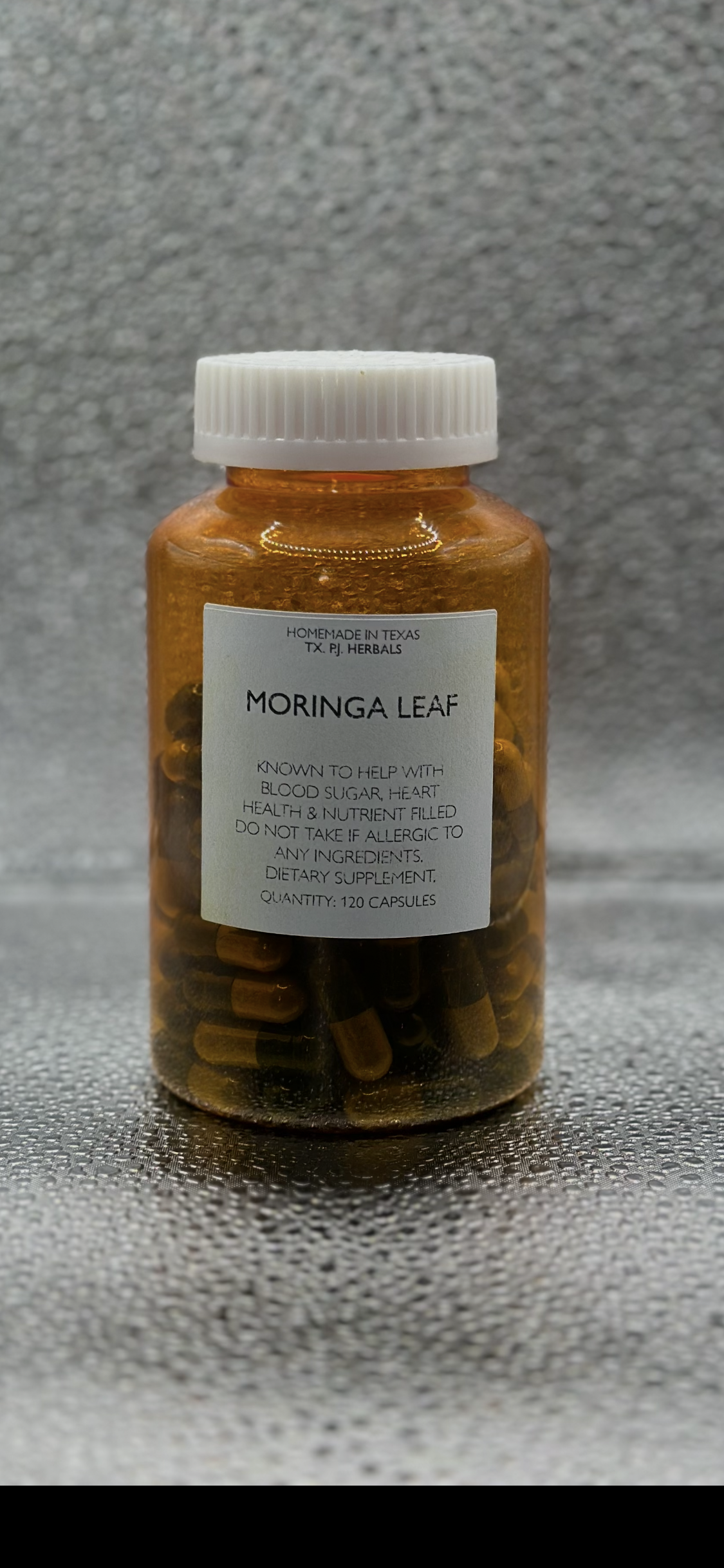 Moringa Leaf Capsules bottle with natural herbal supplement for blood sugar and heart health, 120 capsules.
