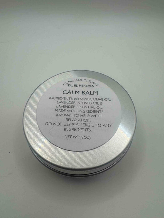 Calm Balm natural herbal remedy in metal tin with beeswax, olive oil, and lavender essential oils for relaxation